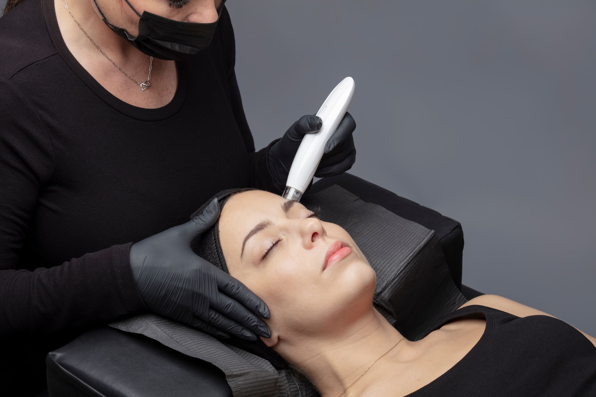 Beautiful Lady Getting Dermaplaning Treatment from Esthetician | Cosmedics MedSpa in Lehi, UT